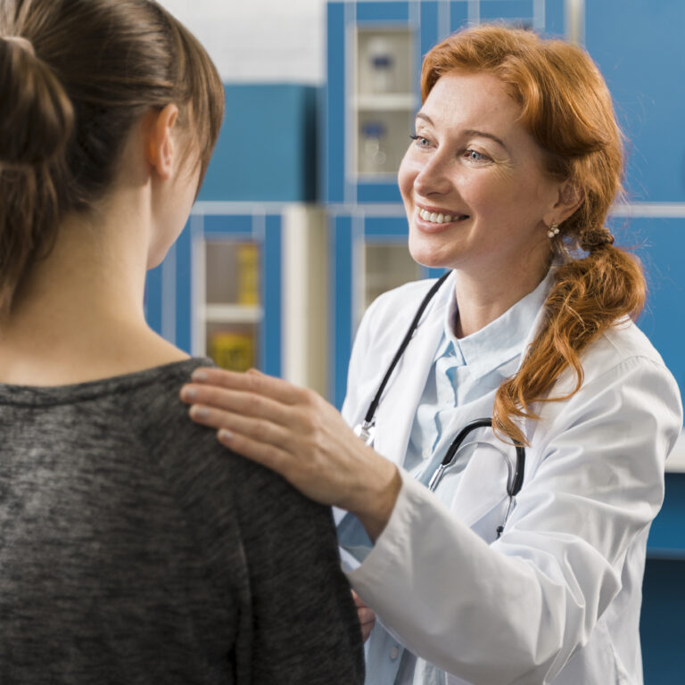 doctor consulting patient smiles