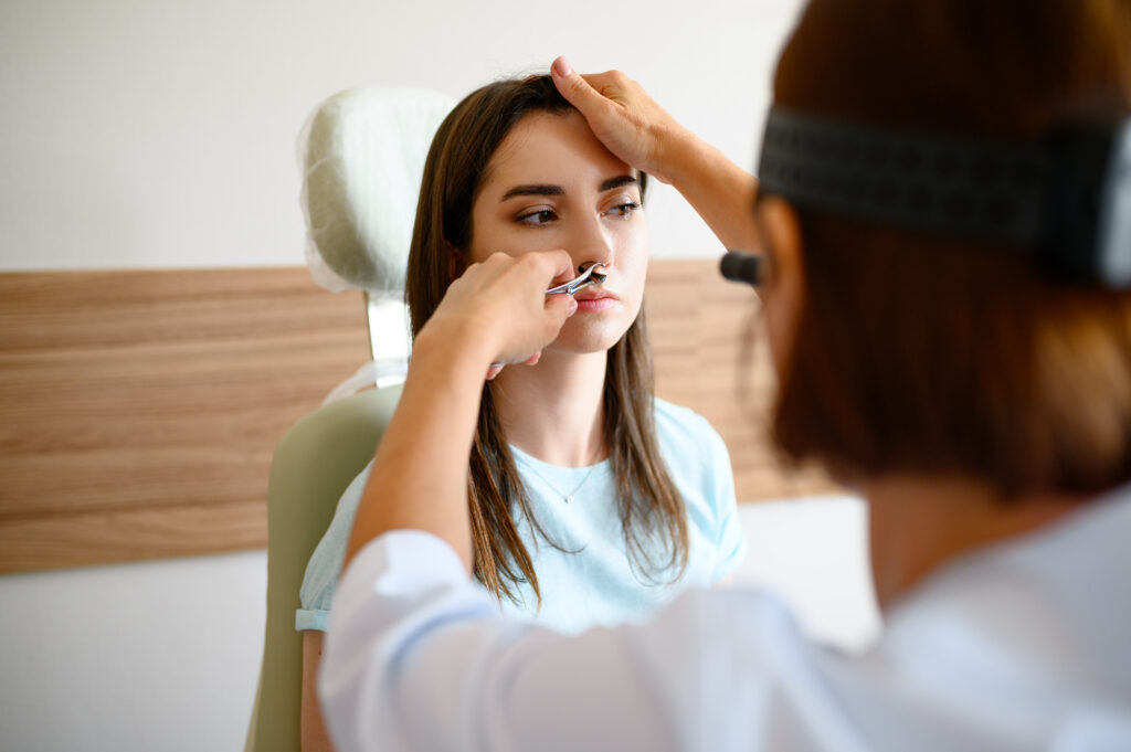 female ent doctor and patient in office exam 2024 11 26 09 44 53 utc